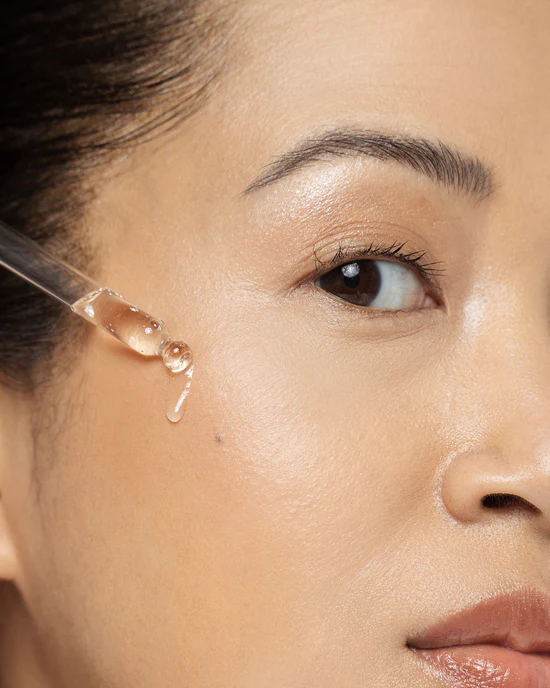 Vivier Serum 10 being applied to a cheek with a dropper